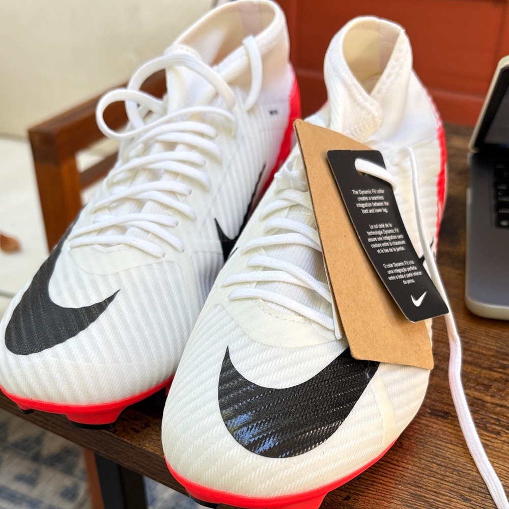 NWT. Nike Mercurial superlfy soccer cleats with neon red accents and soles Sz 10